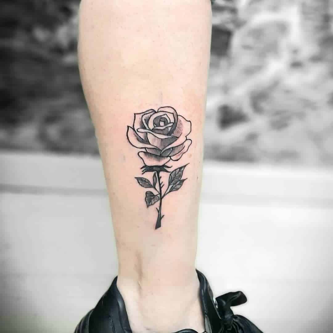 26] Simplicity Speaks Volumes: Single Rose Leg Tattoo