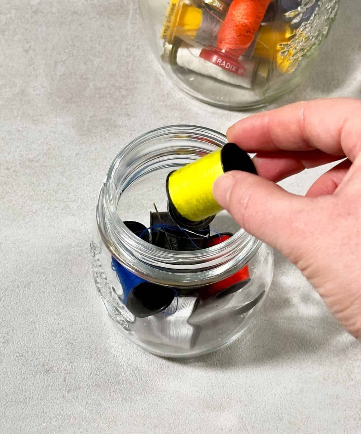 Use Glass Jars to Store Sewing Spools