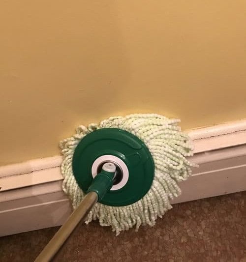 Use Dry Spin Mop to Dust Baseboards