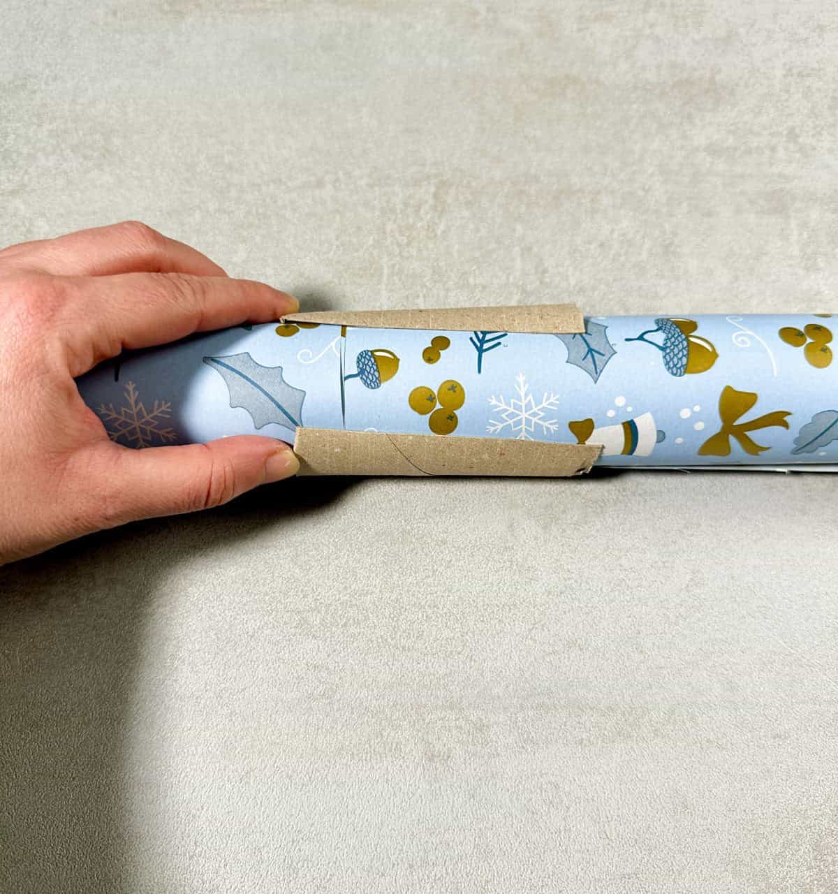 Use a Toilet Paper Roll to Store Wrapping Paper