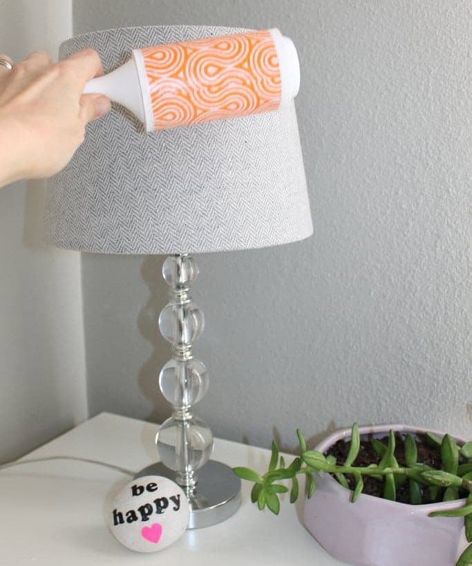 Use a Sticky Roller to Dust Lamp Shades