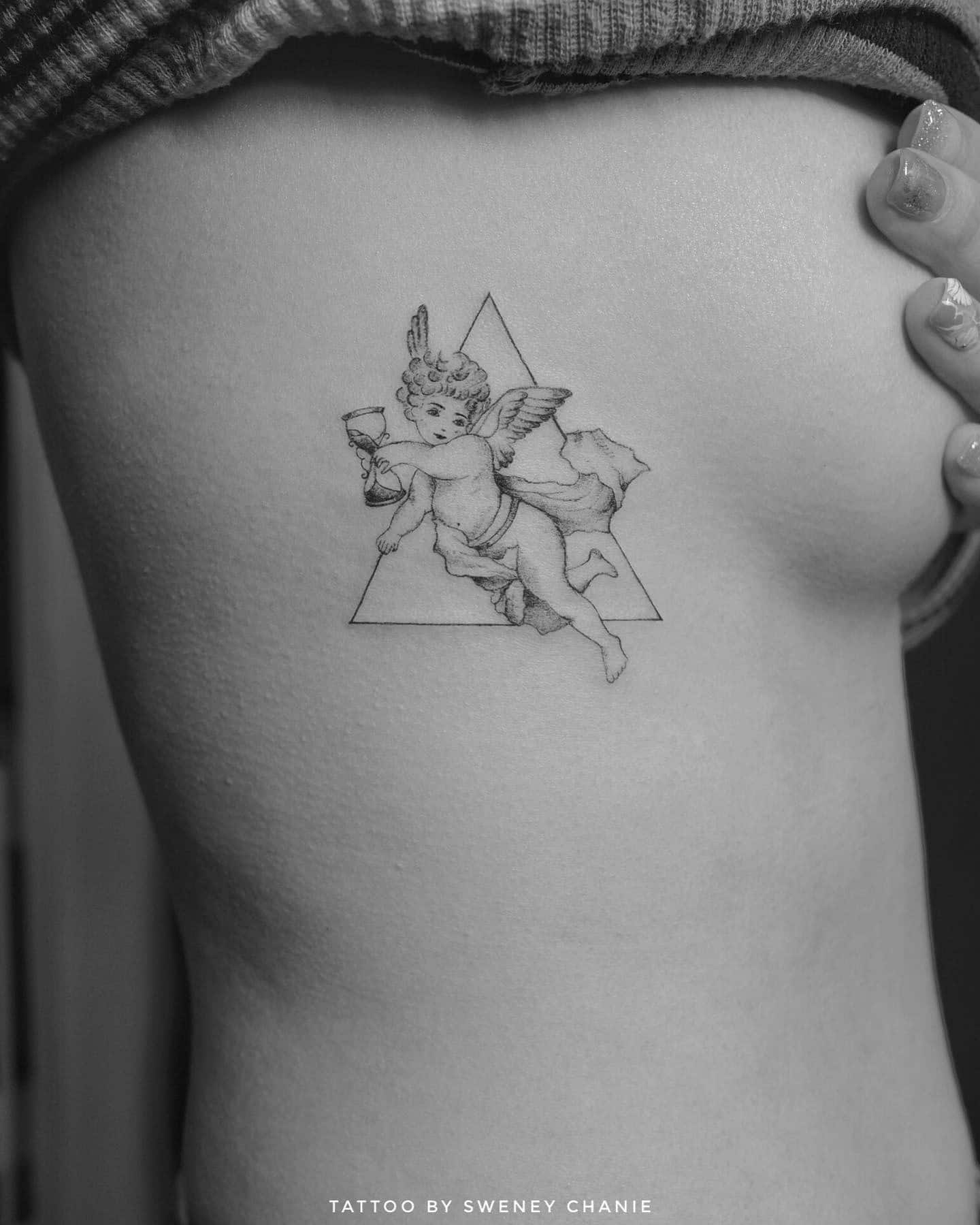 24] Baby Angel Hourglass Rib Tattoo: Timeless Innocence