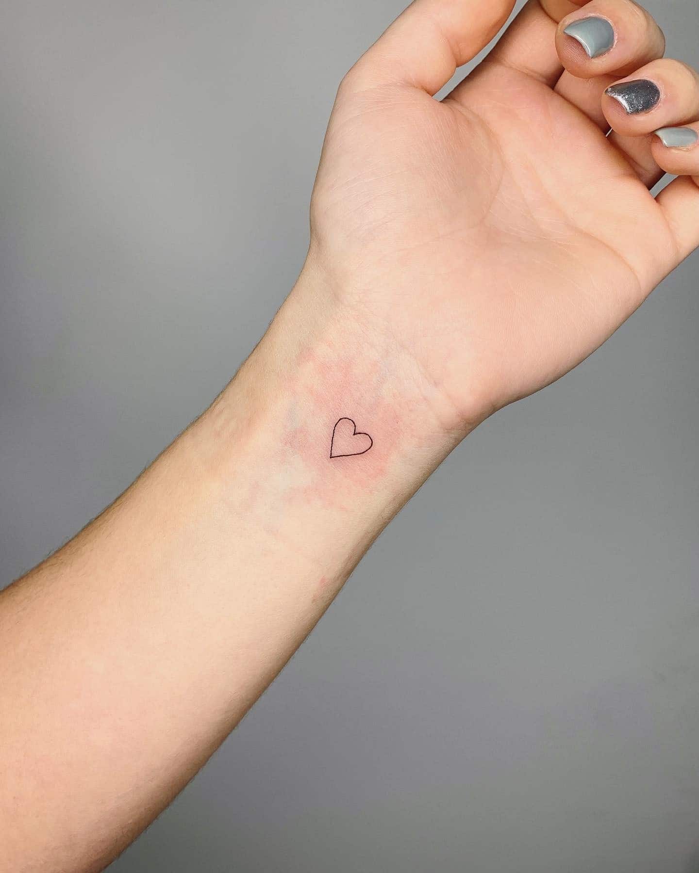 21] Inner Wrist Small Purple Heart Tattoo: Subtle and Stylish