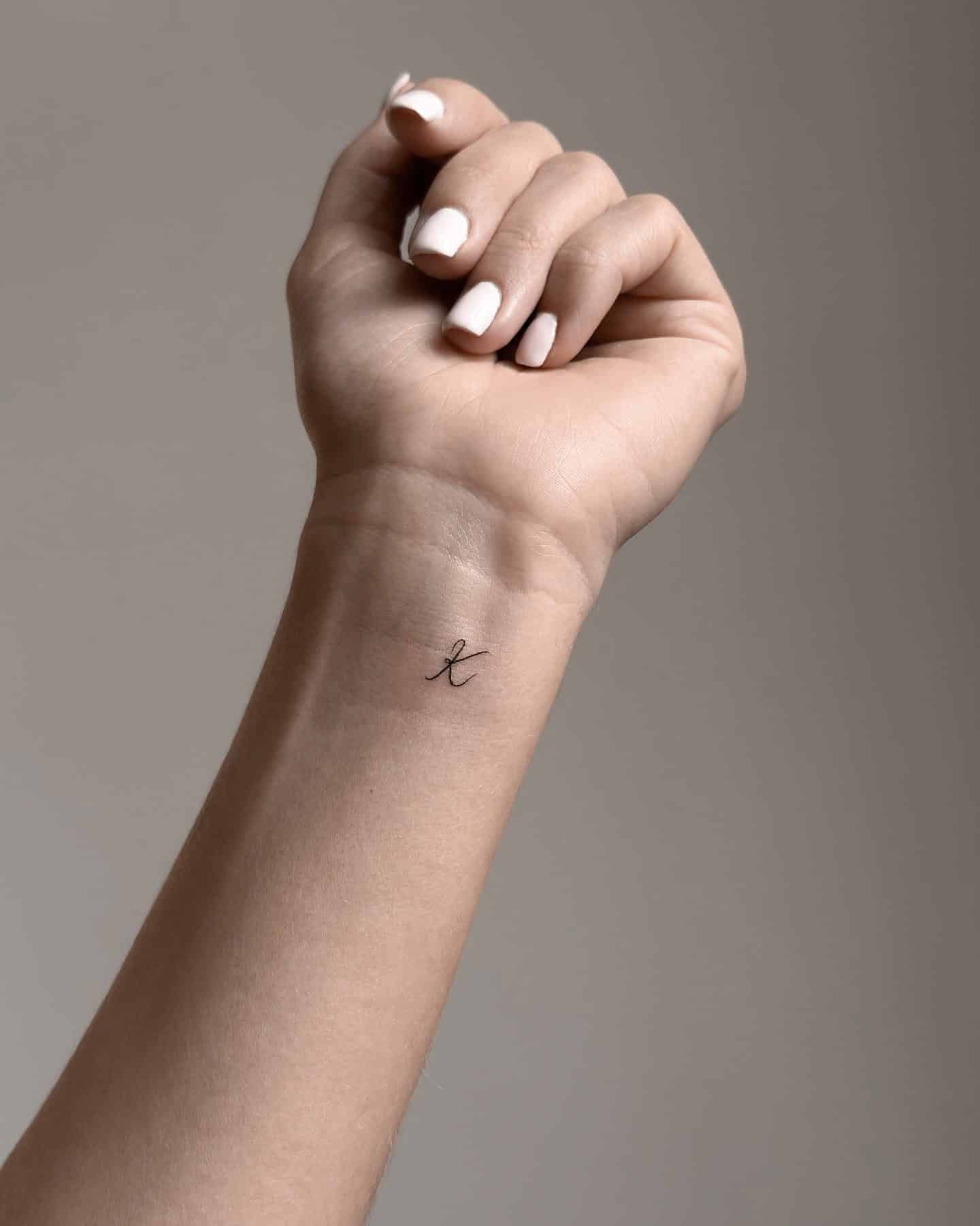 37] Inner Wrist ‘K’ Letter Tattoo: Stylish Statement