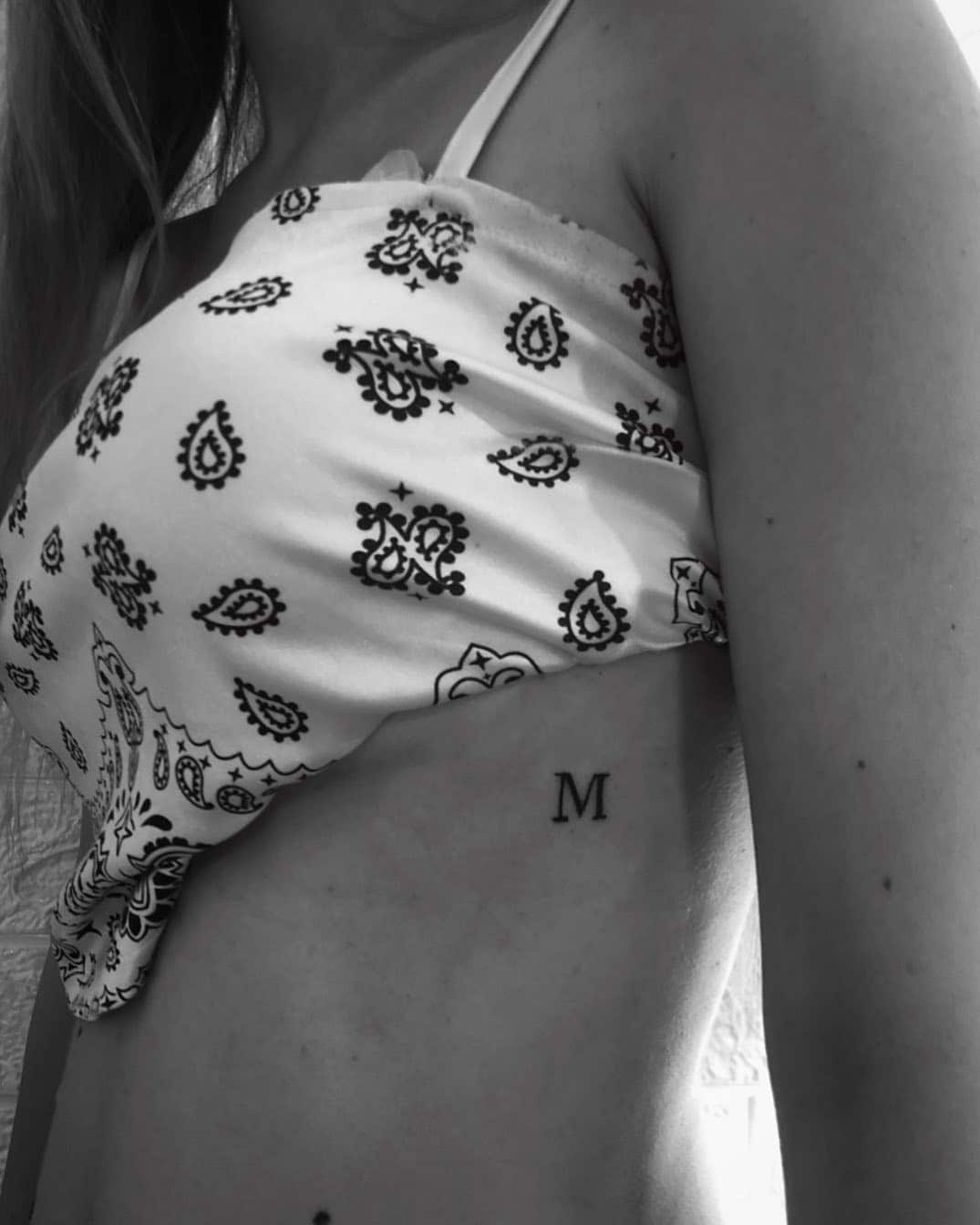 11] ‘M’ Letter Tattoo: Rib Charm