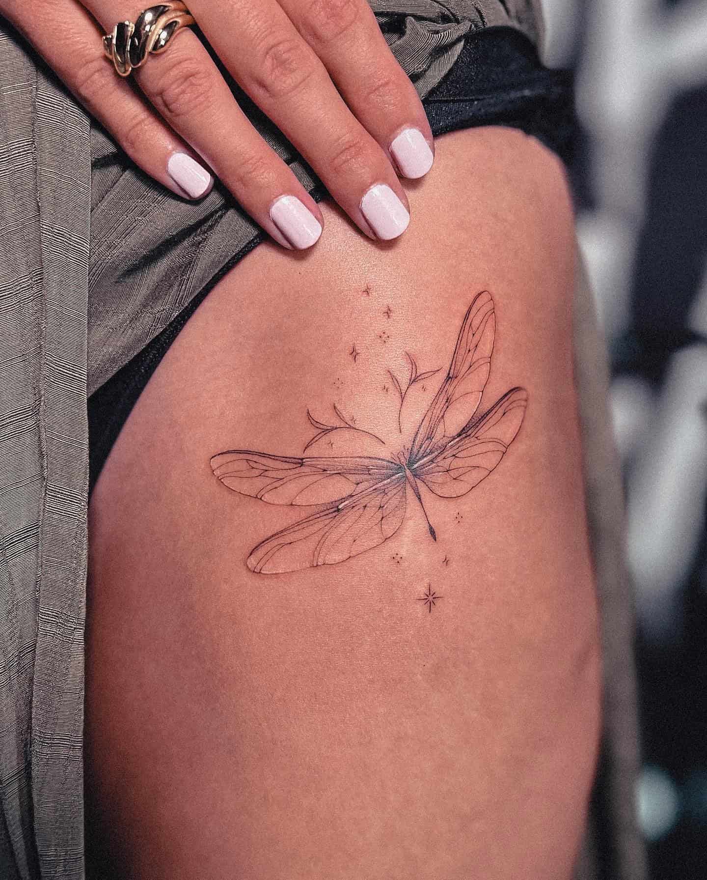 15] Dragonfly with Sparkles Hip Tattoo: Nature’s Ballet