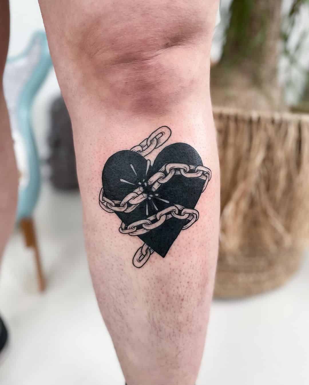 14] Sad Love Heart Tattoo Below the Knee: Emotive Design