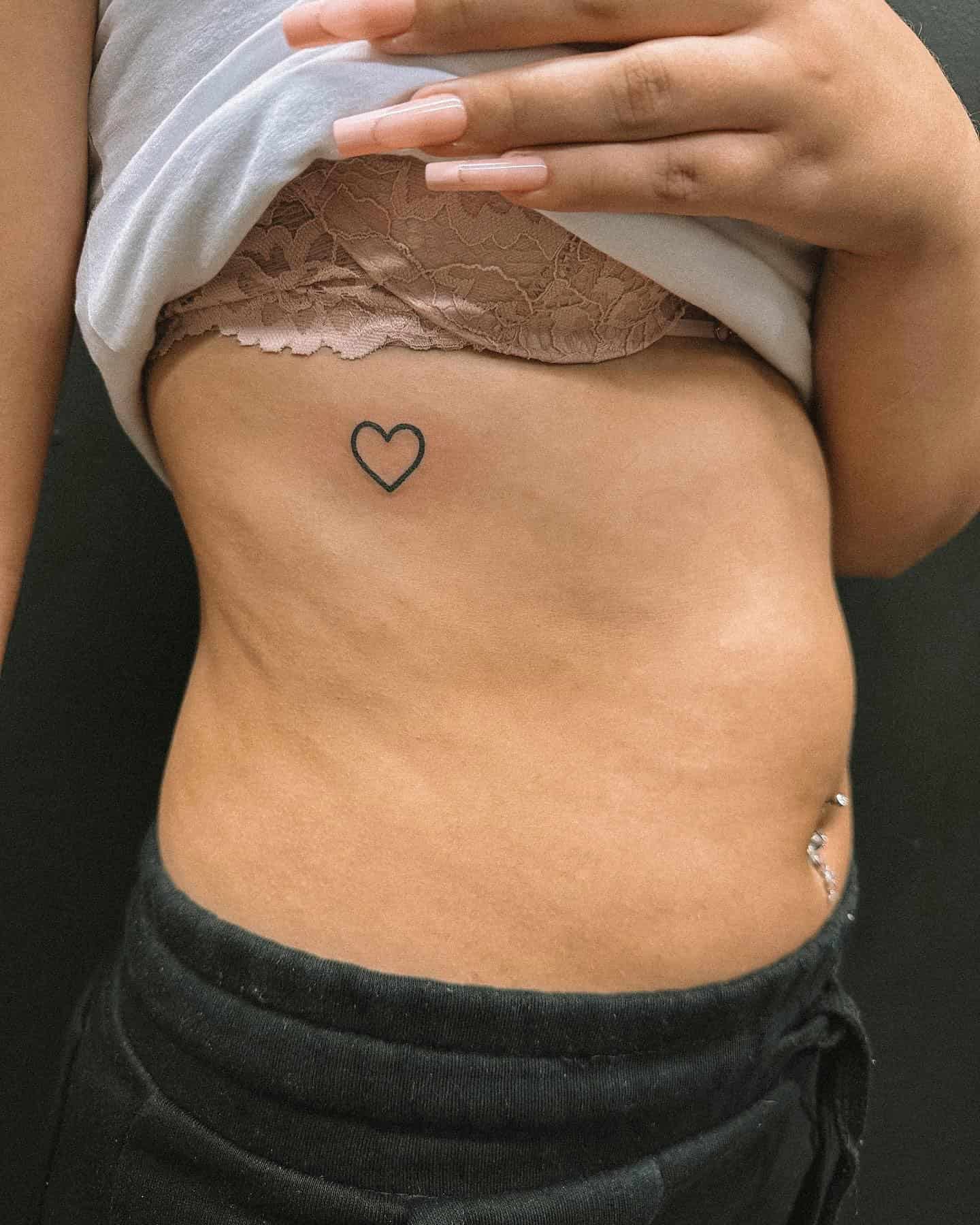 62] Feminine Heart Tattoo: Rib Cage Elegance