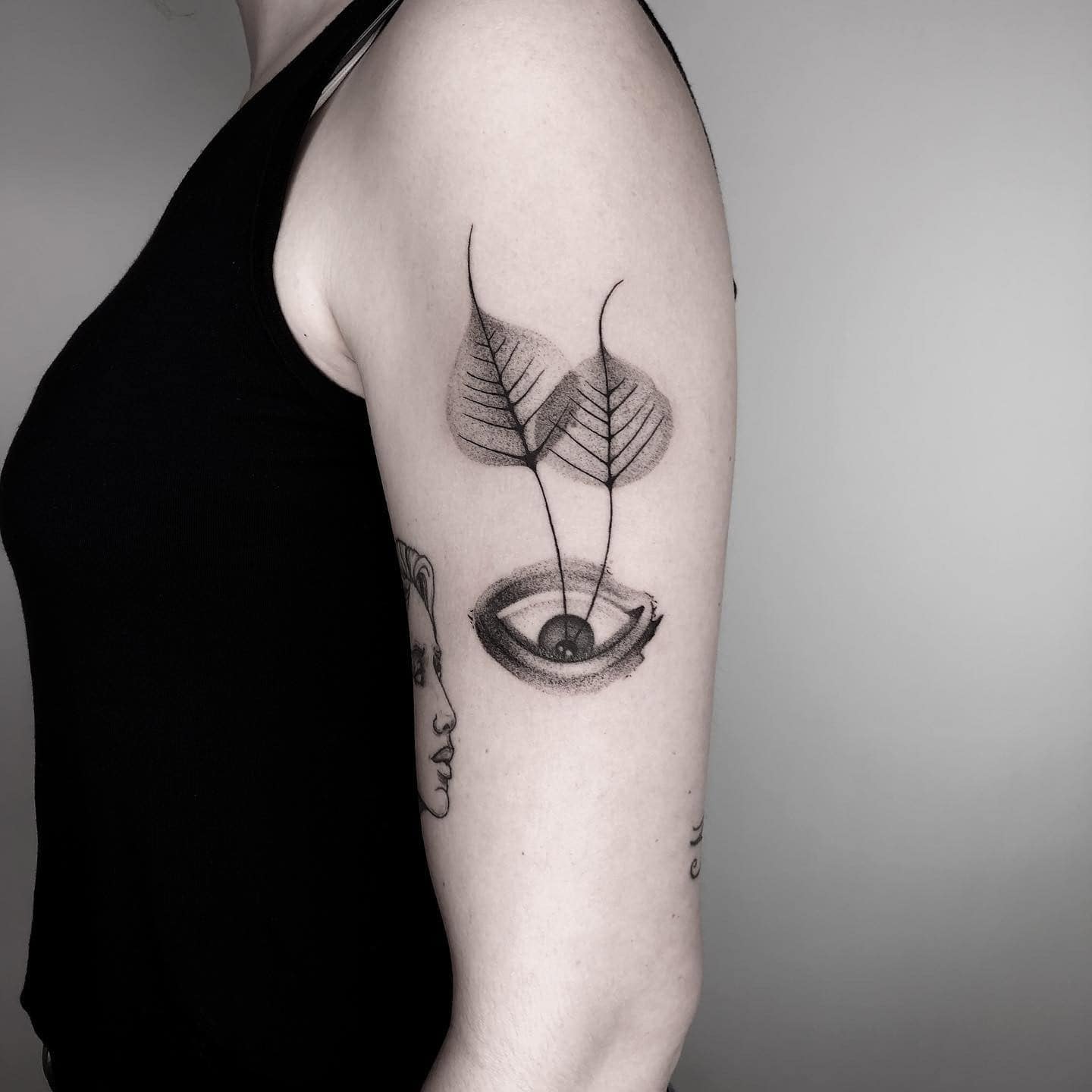 8] Upside Down Eye Tattoo Design on Hand With Two Leaves