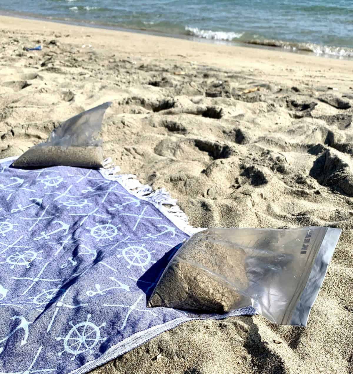 Fill Bags with Sand to Hold a Towel in Place