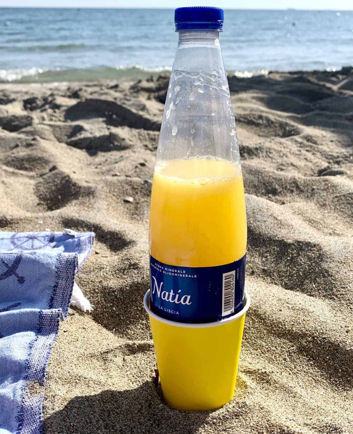 Use a Paper Cup to Prevent Sand from Sticking to Bottles