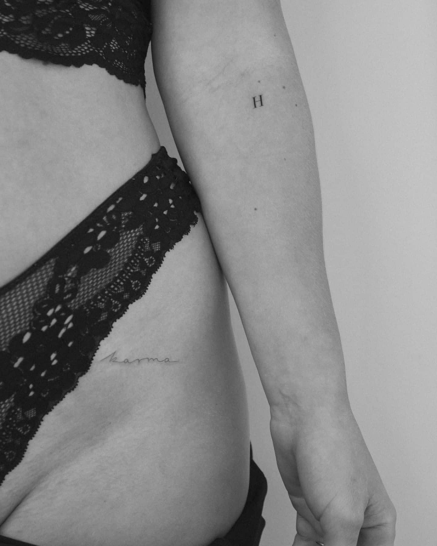 21] ‘H’ Letter Tattoo Below Elbow: Feminine Flourish