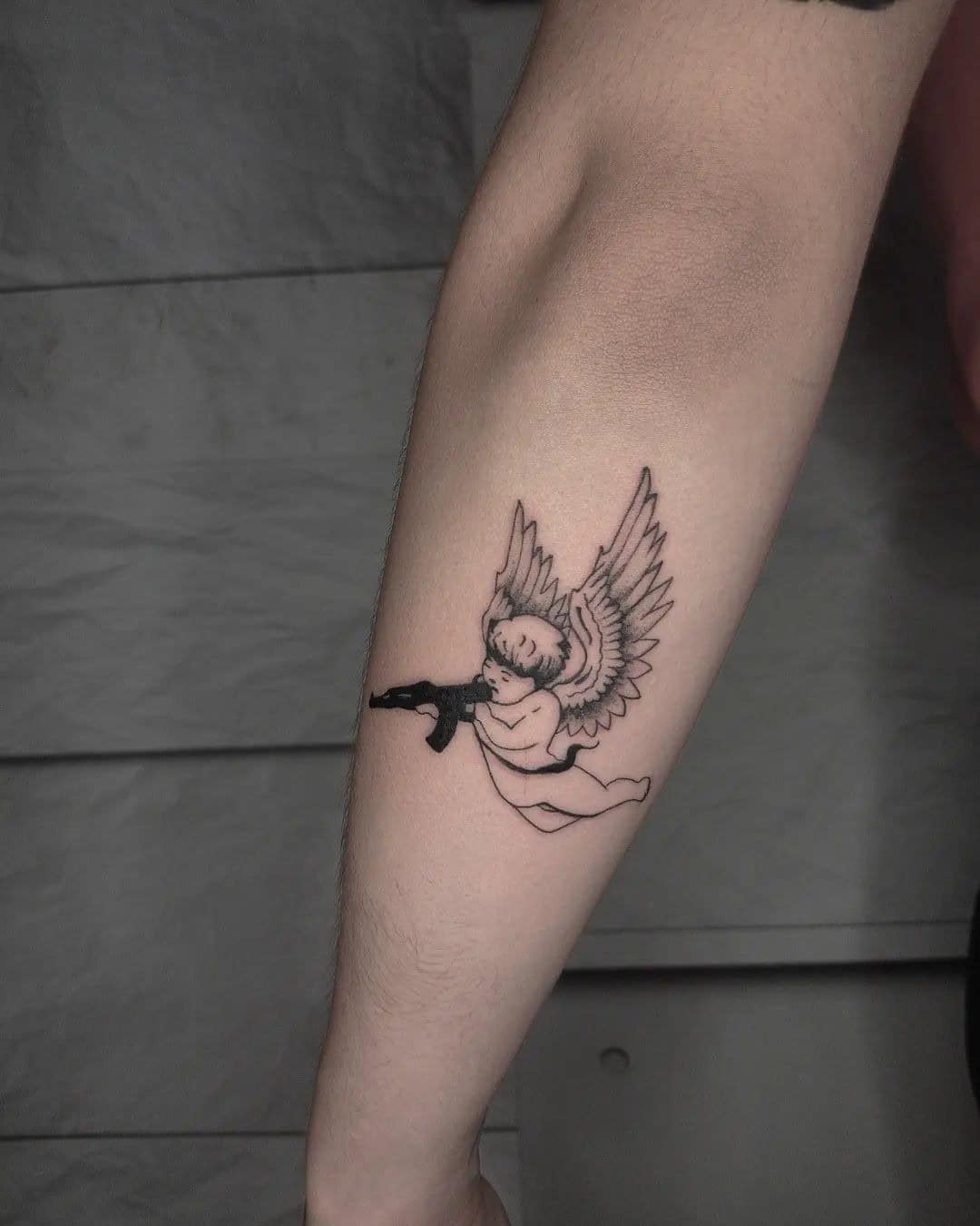 23] Outer Forearm Angel with Gun: Below the Elbow