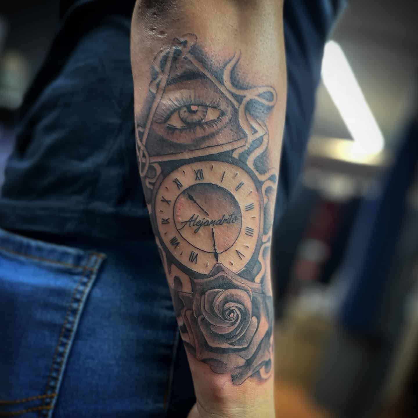 7] Unisex Eye Tattoo Design Paired With A Clock And Rose