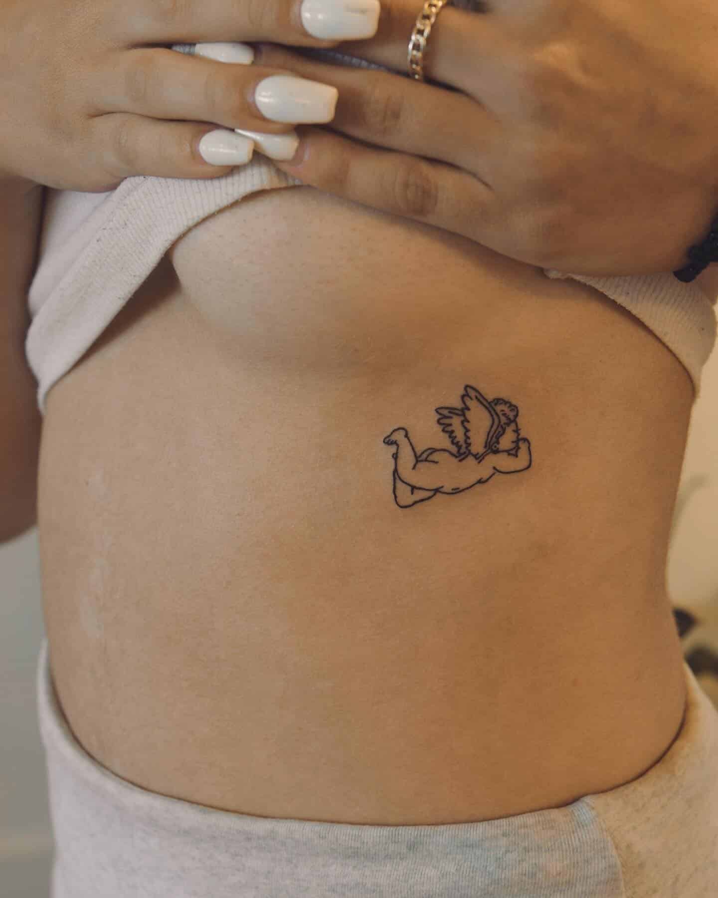 16] Adorable Baby Angel Rib Tattoo: Tiny Guardian