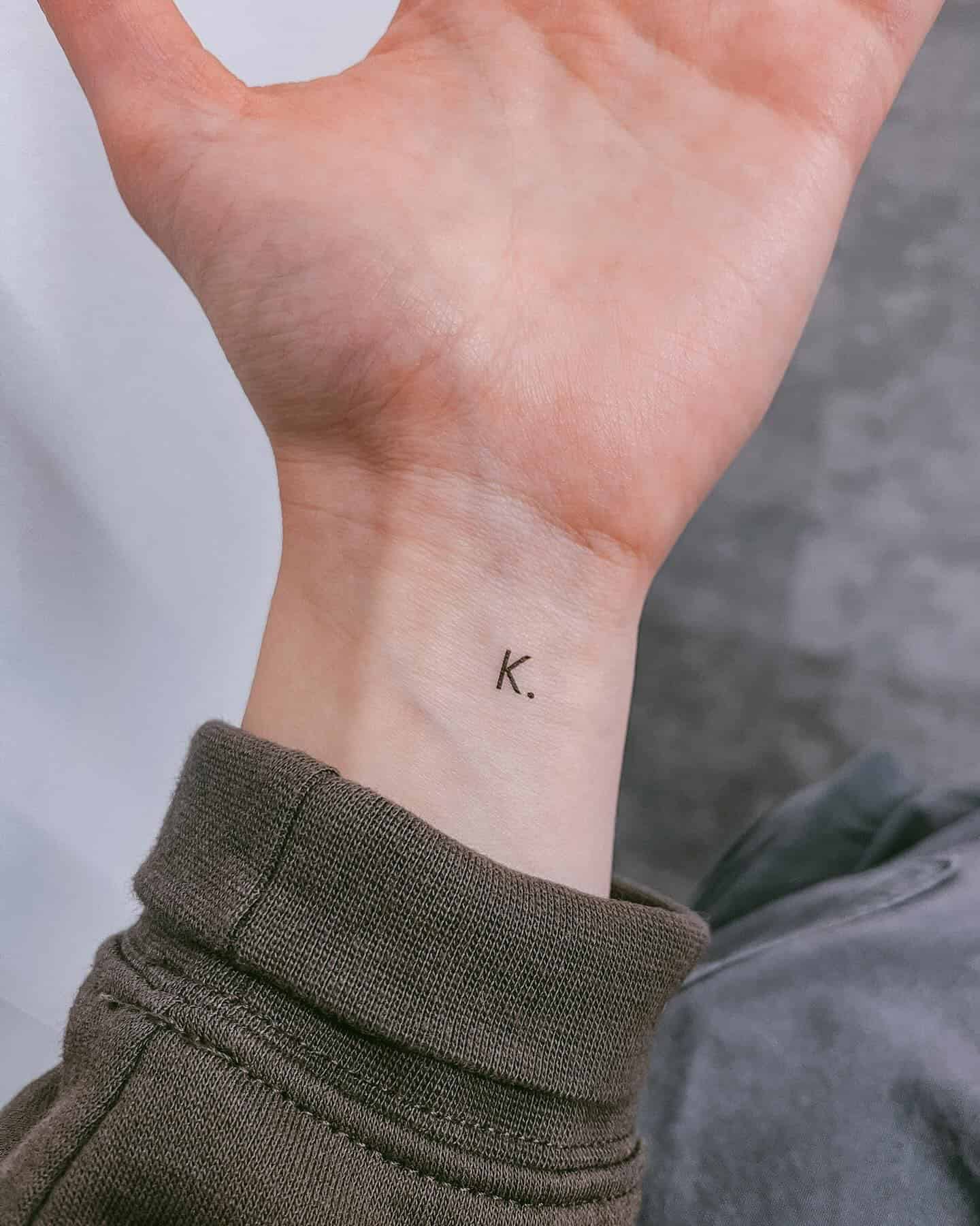 4] ‘K.’ Inner Wrist Tattoo: Reflecting Individuality