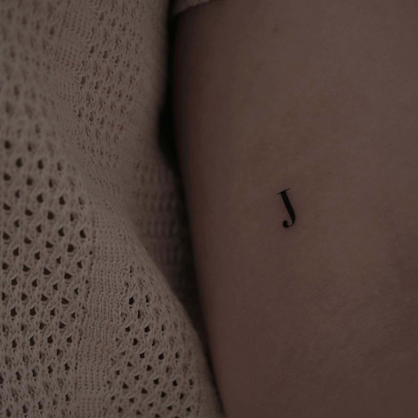 10] Tiny ‘J’ Inner Arm Tattoo: Understated Sophistication