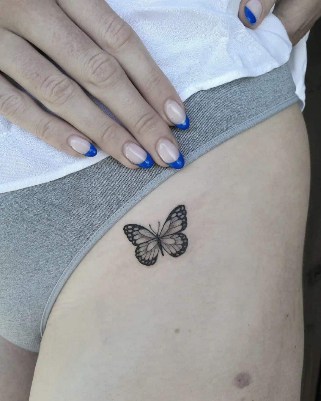 54] Small Butterfly Hip Tattoo: Graceful Transformation