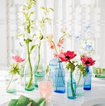 Colored Glass Bottles with Flower Arrangement