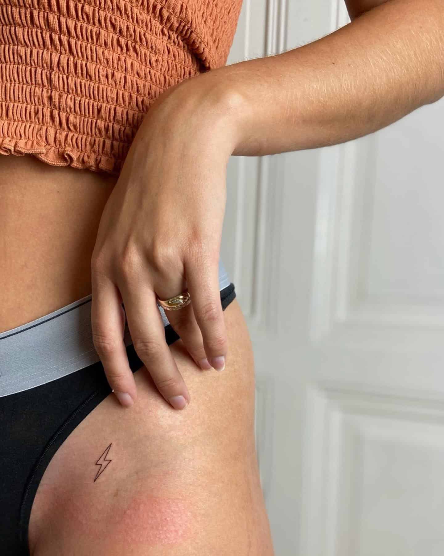 50] Lightning Bolt Tattoo on Hip: Electric Edge