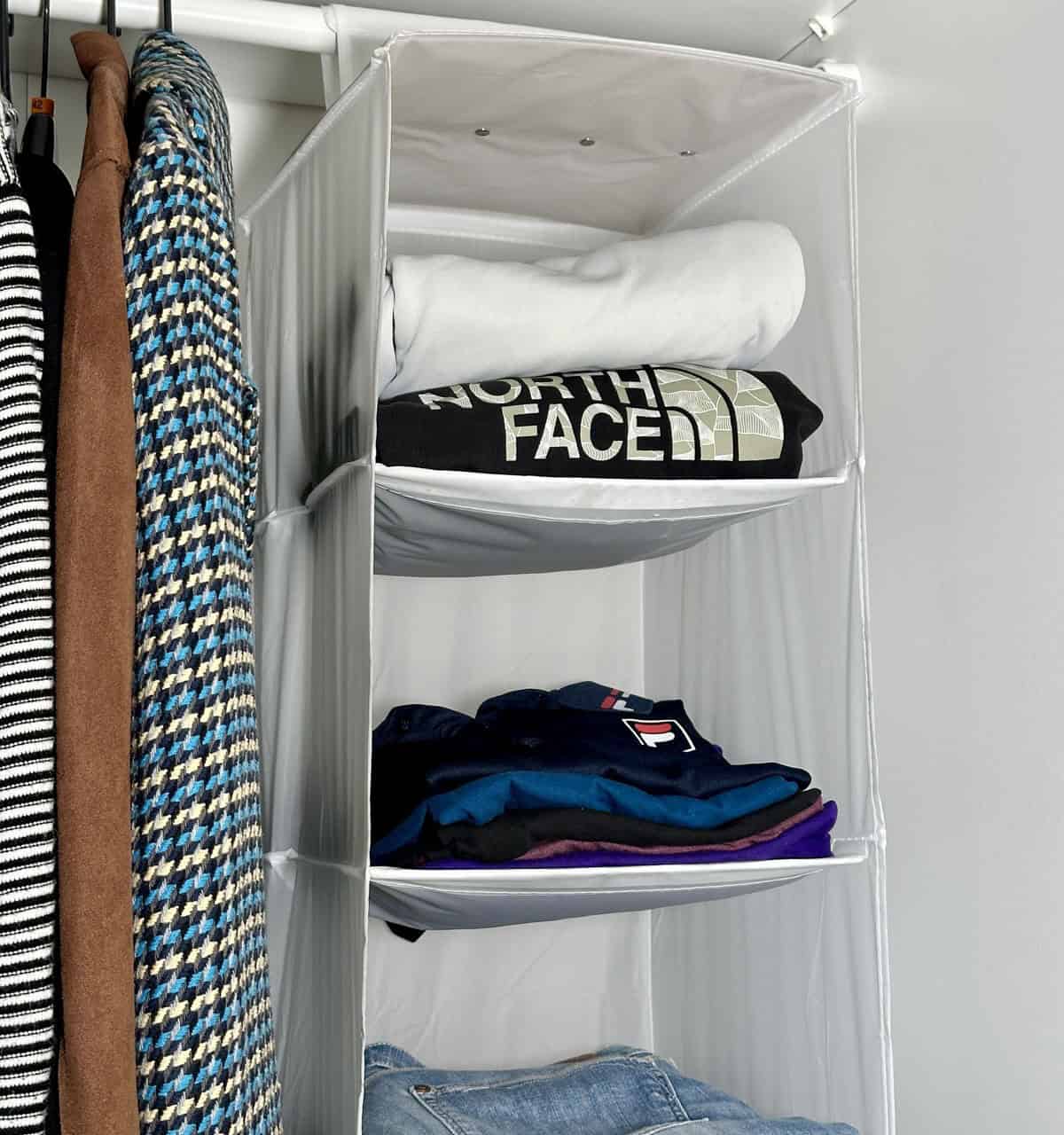 Use a Hanging Organizer to Store Clothes Vertically