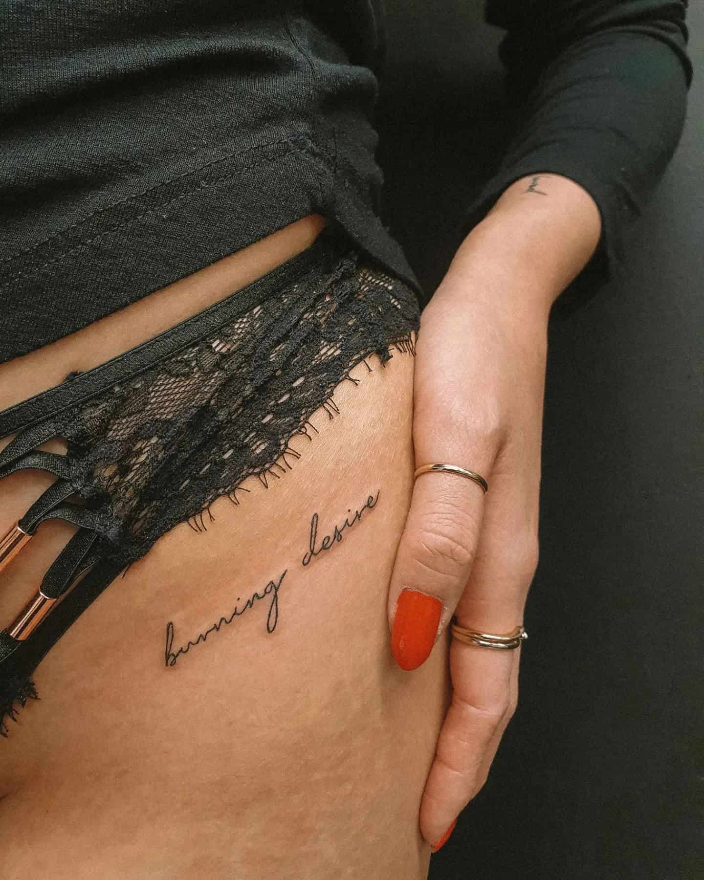 55] ‘Burning Desire’ Hip Script Tattoo: Passionate Flames