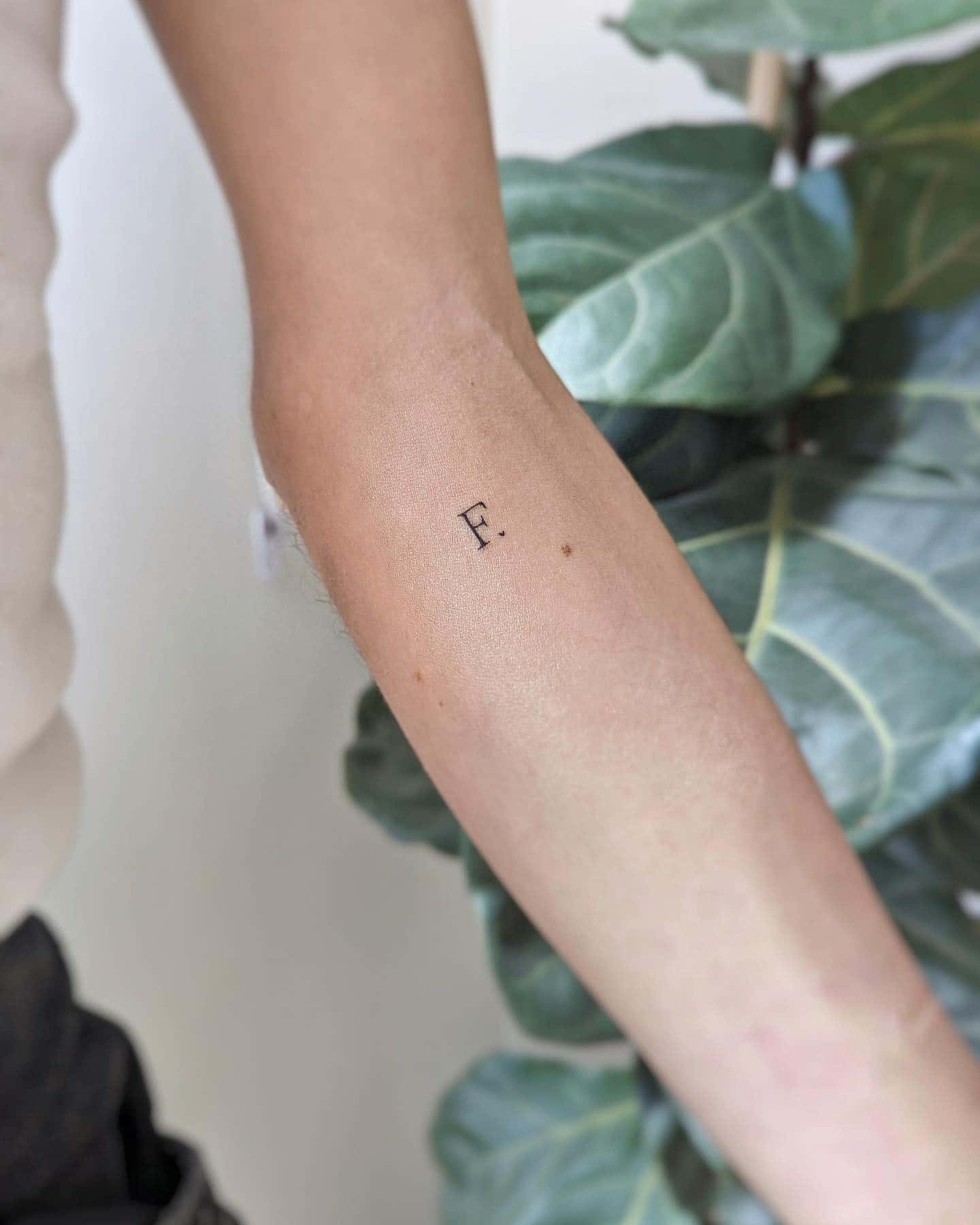 40] Below Inner Elbow ‘F.’ Text Tattoo: Elbow Elegance