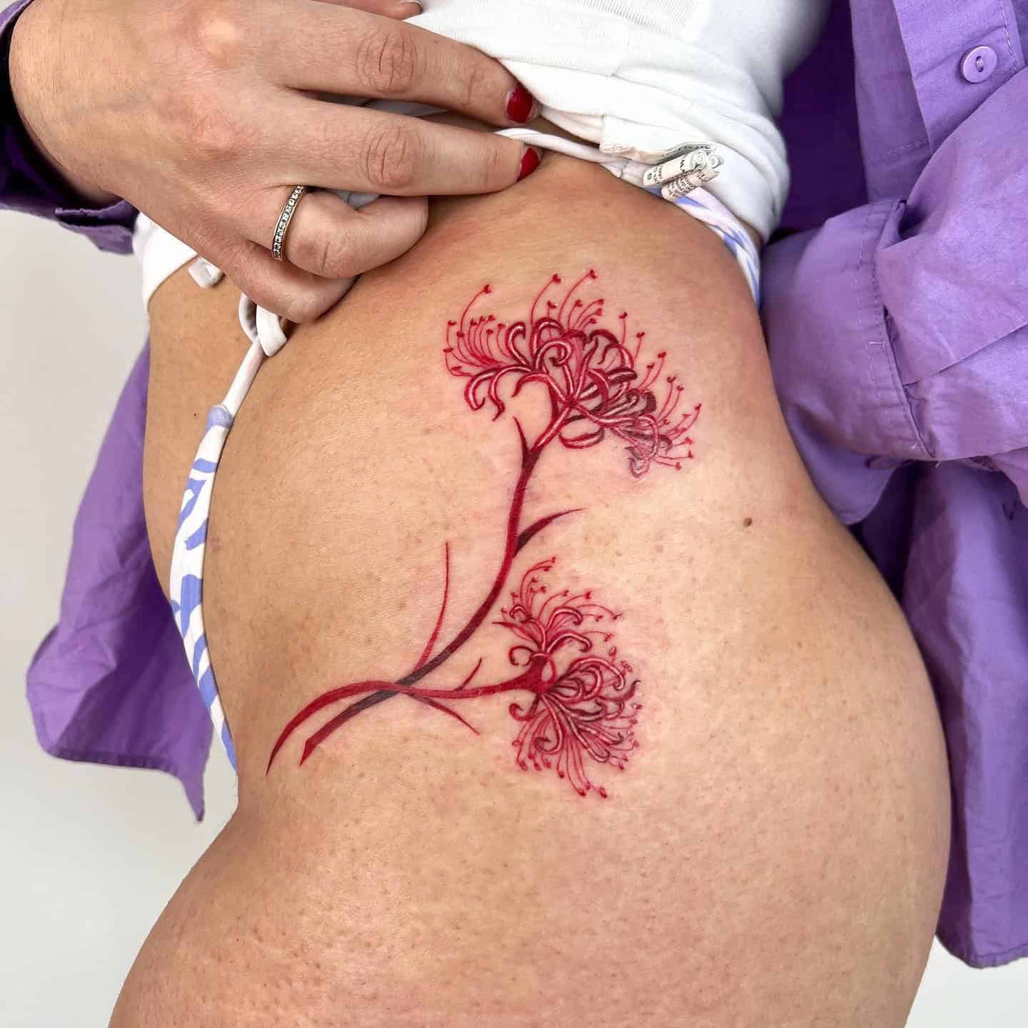 16] Red Spider Lily Hip Tattoo: Enigmatic Beauty