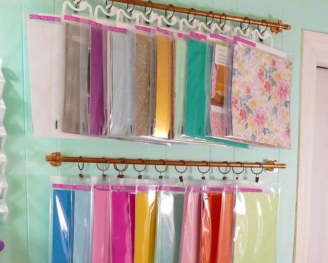 Place paper in bags and hang on a curtain rod