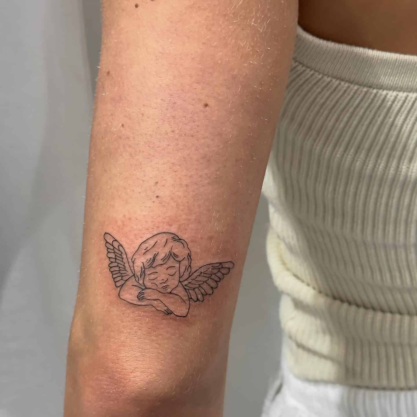 17] Sleeping Baby Angel Elbow Tattoo: Sweet Dreams