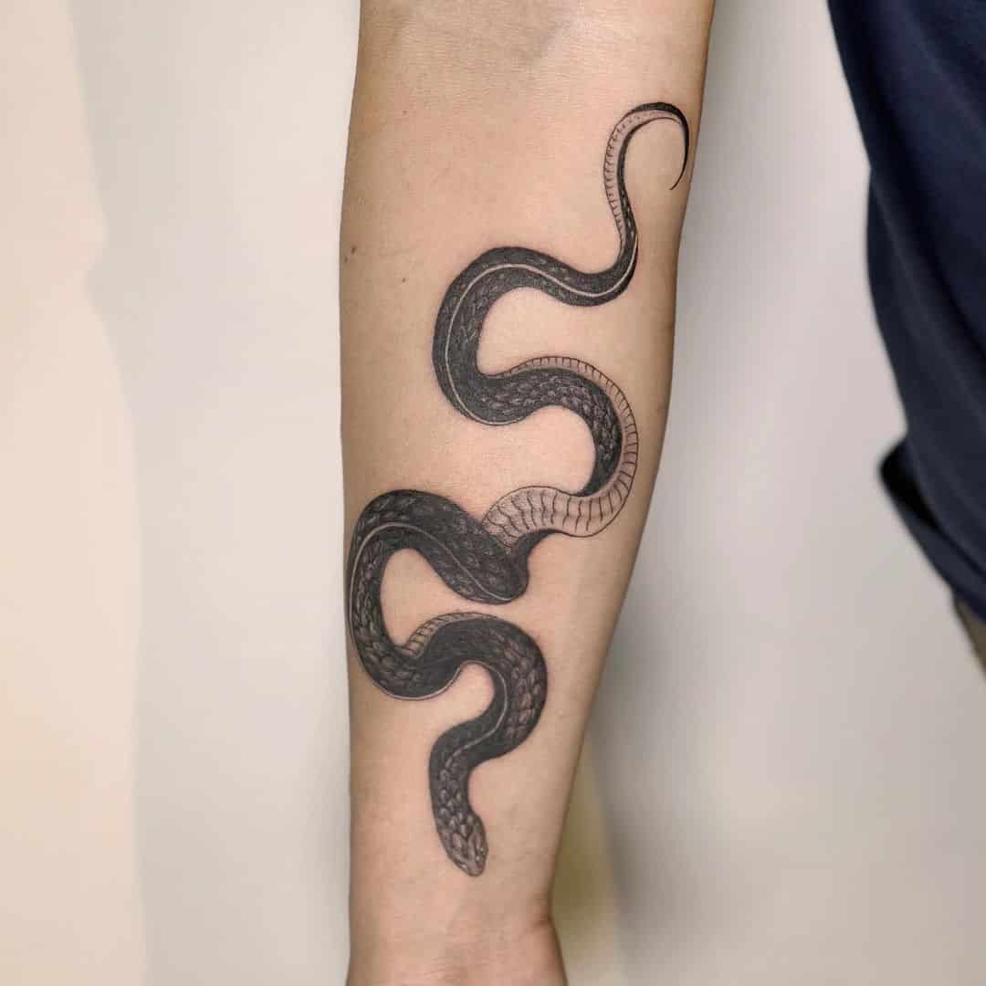 20] Black Scale Snake Forearm Tattoo: Serpentine Elegance