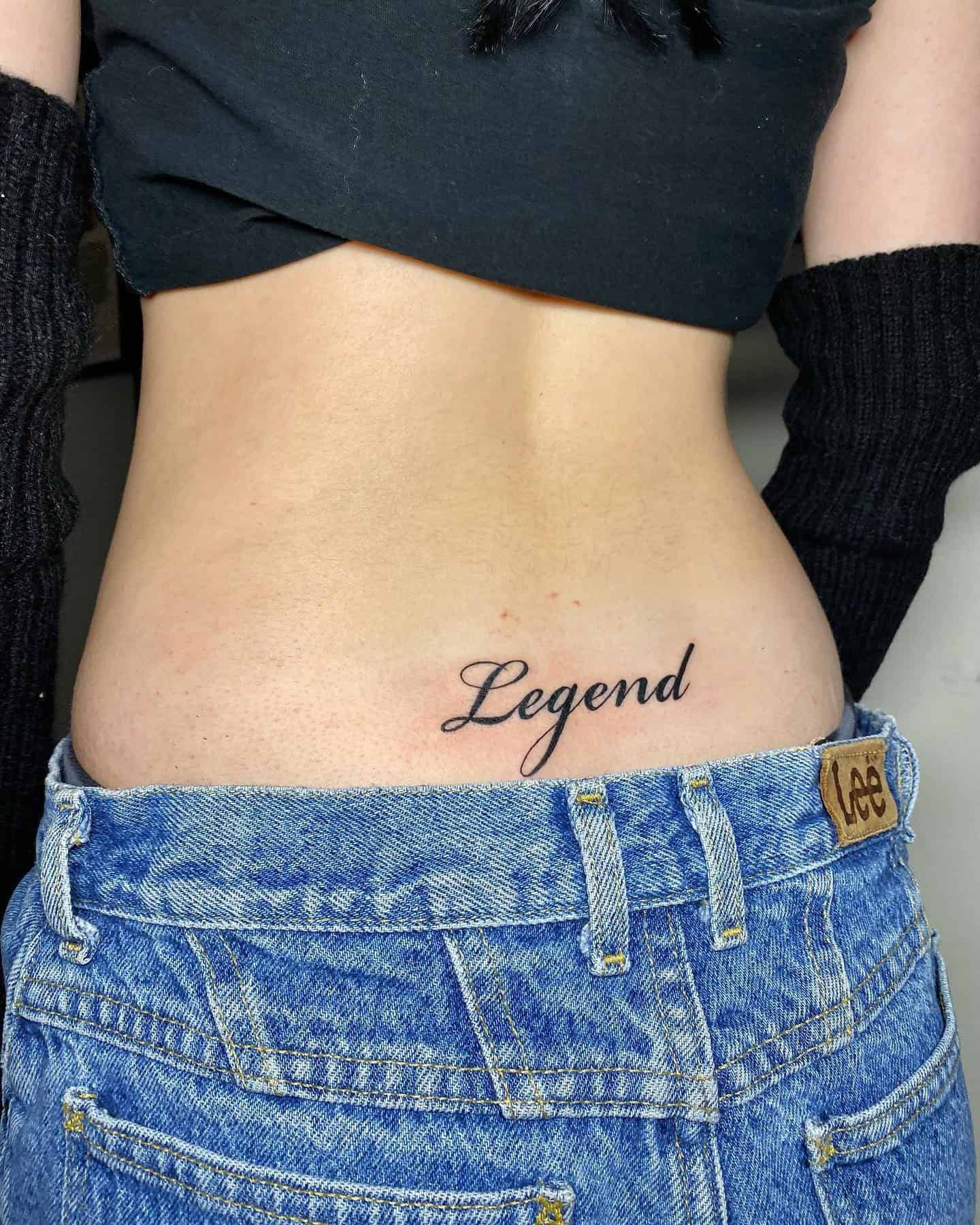 27] ‘Legend’ Lower Back Lettering Tattoo: Legendary Mark