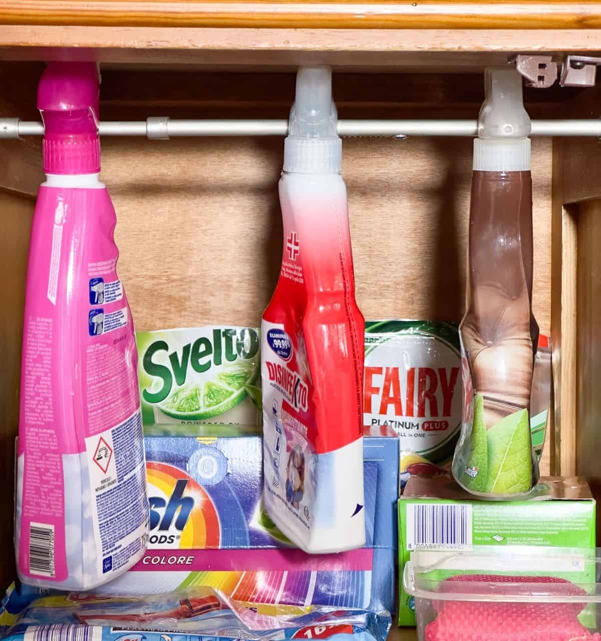 Use a Tension Rod to Hang Detergents