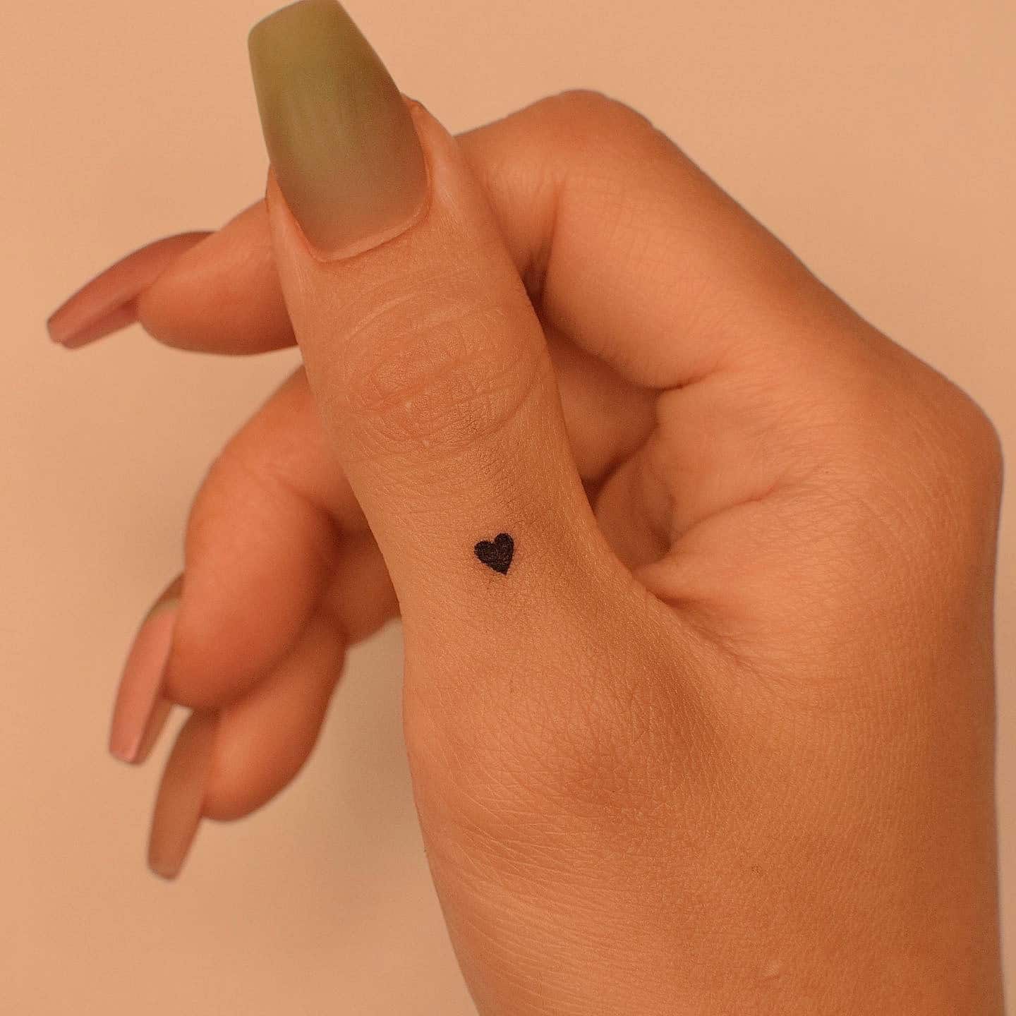 68] Minimalist Thumb Charm: Love Tattoo in Black