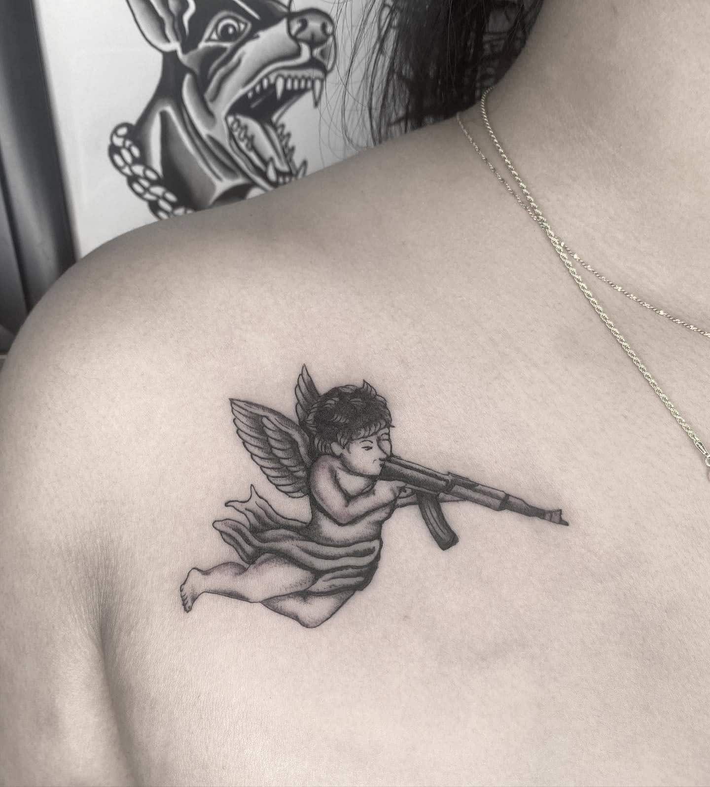 22] Baby Angel Collarbone Tattoo: Heavenly Protector