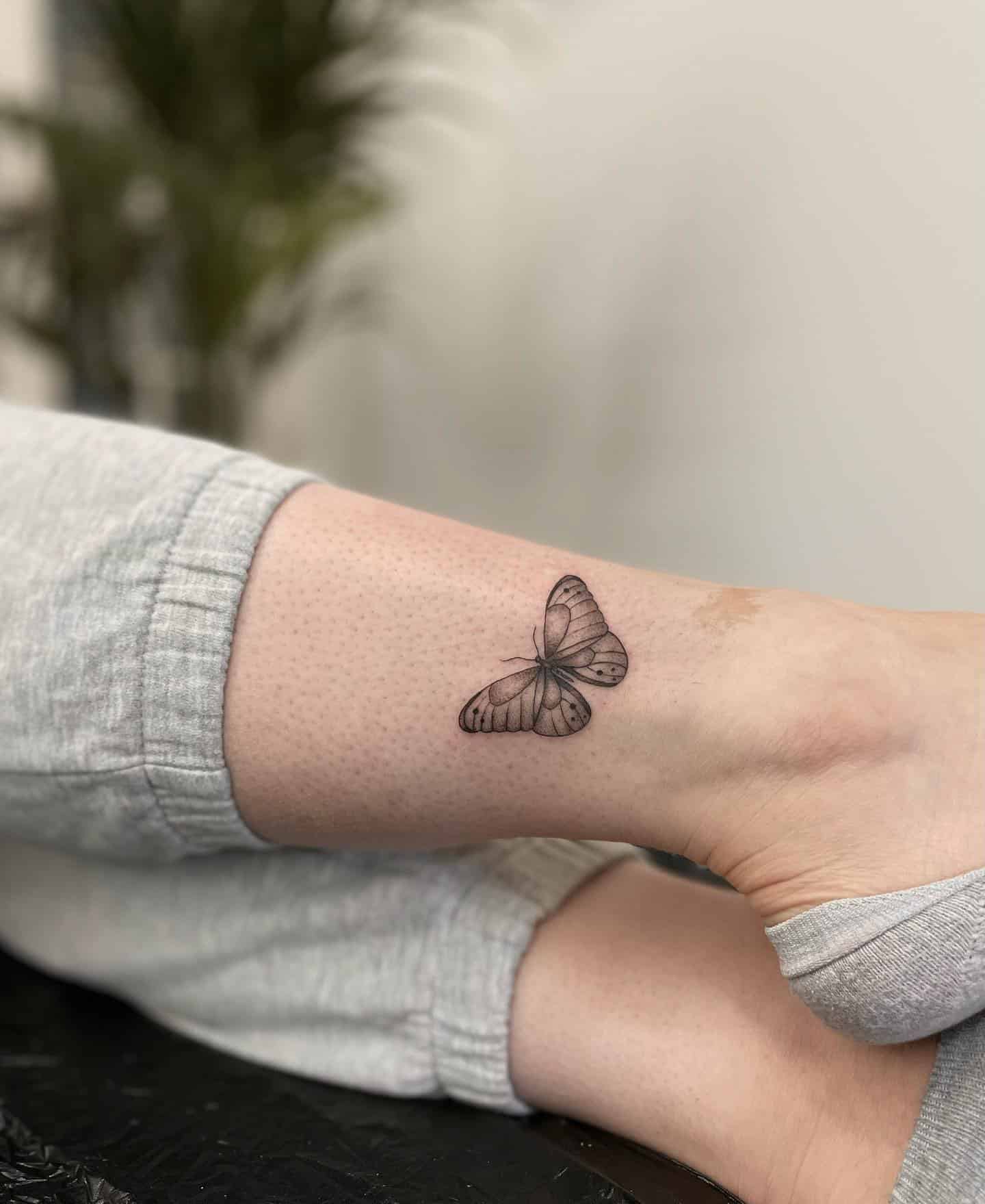 10] Cute Detailed Butterfly Leg Tattoo: Delicate Wings