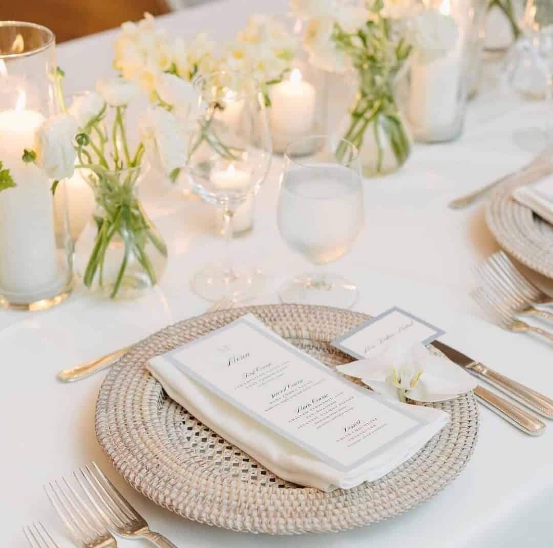 White Roses, White Candles, And Whicker Plates