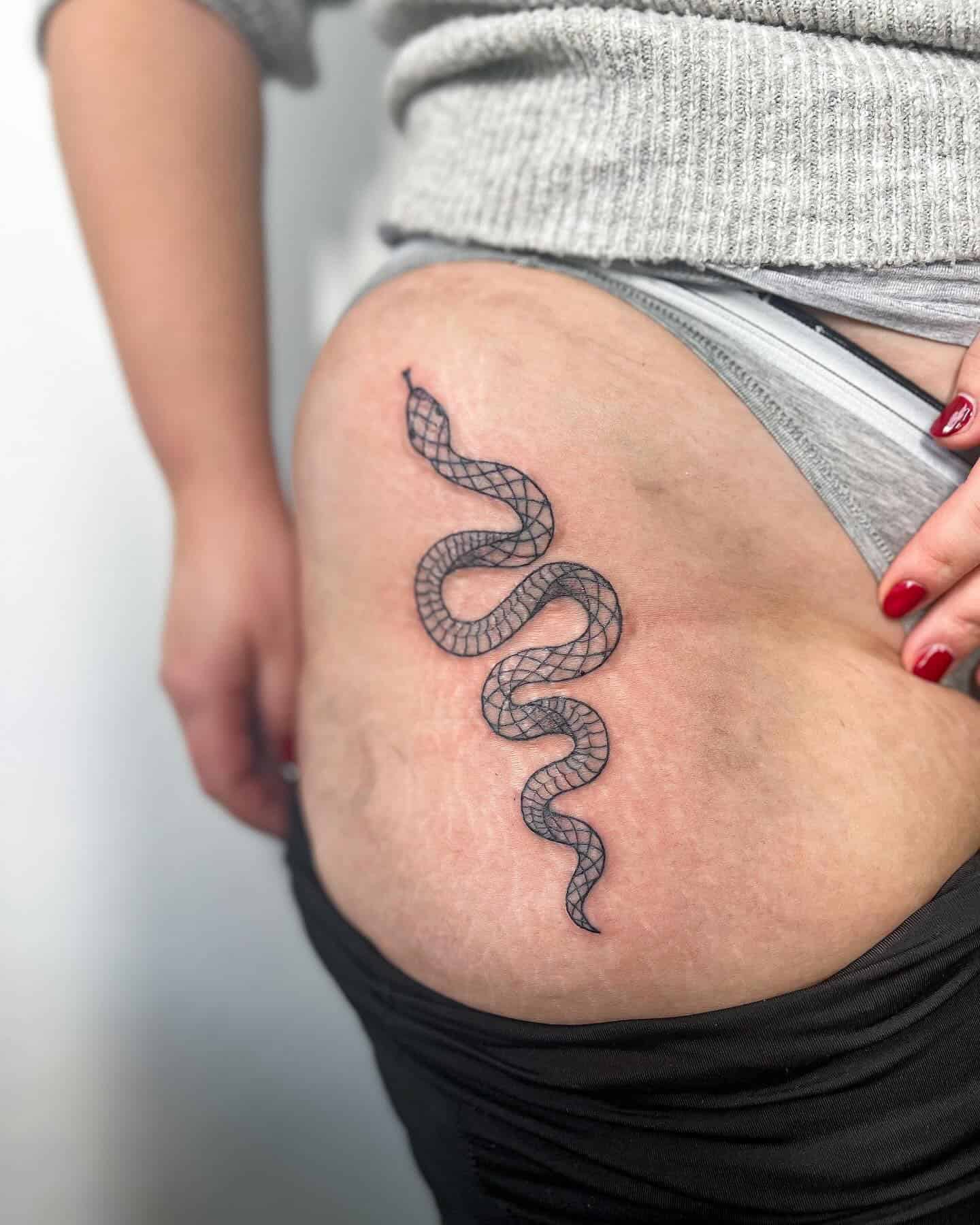 20] Snake Hip Tattoo: Serpentine Elegance