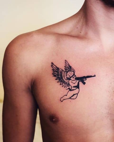 14] Front Chest Angel With Gun Tattoo: Statement Piece for Chest Area