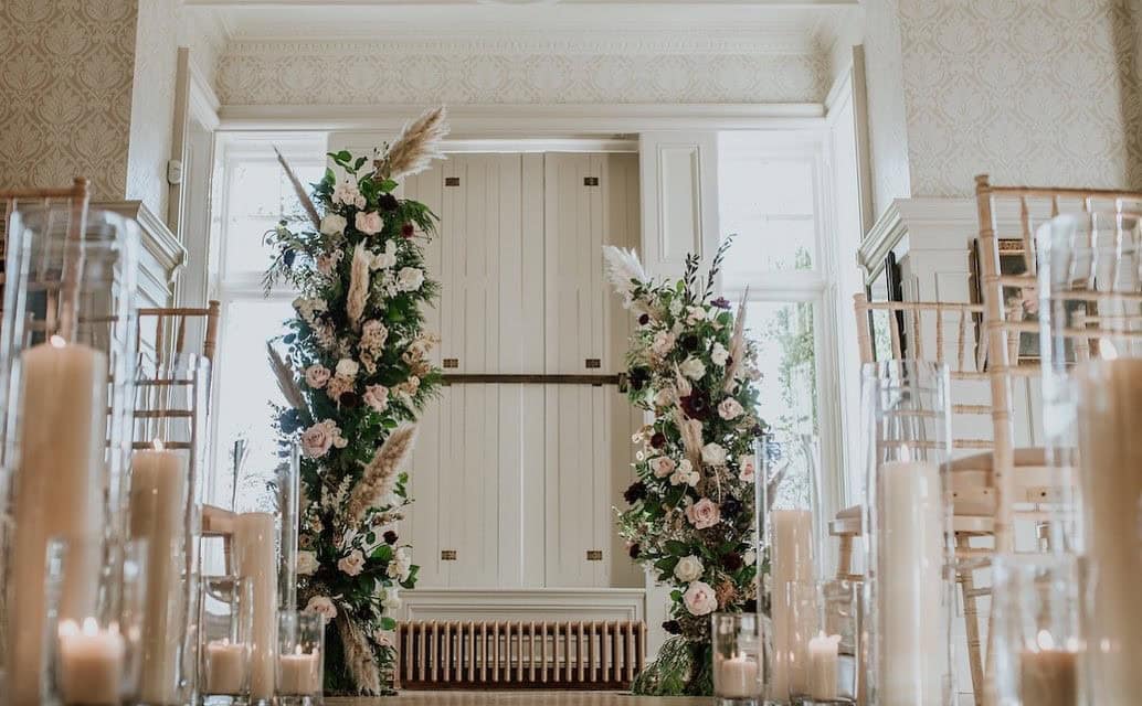 Statement Floral Pillars and Burning Candles