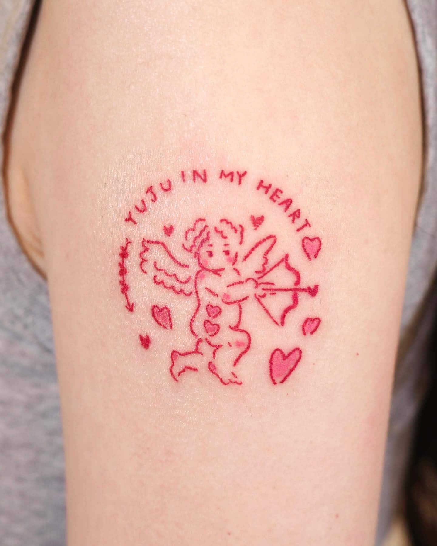 4] Red Ink Baby Angel Tattoo: Elegant Outlines