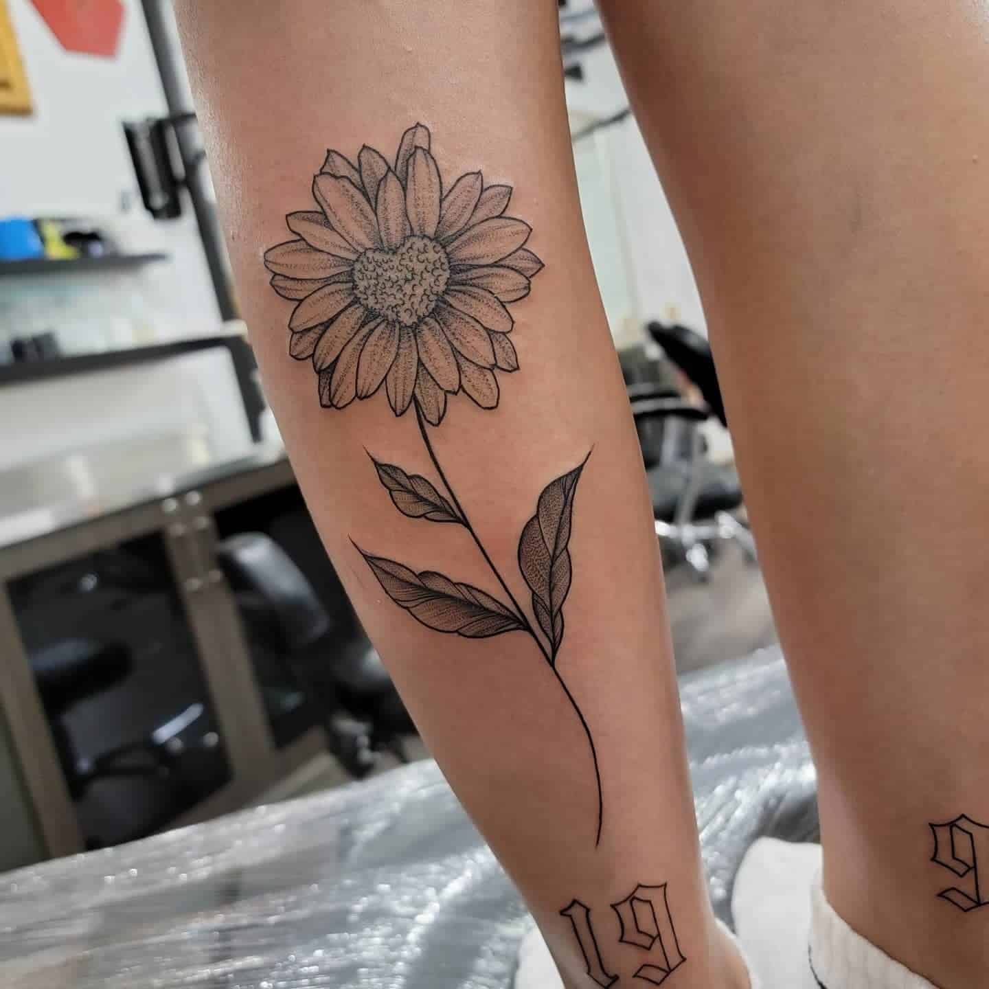 33] Blossoming Beauty: Sunflower Calf Tattoo