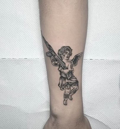 3] Forearm Shaded Angel With Gun Tattoo: Detailed and Intriguing Ink