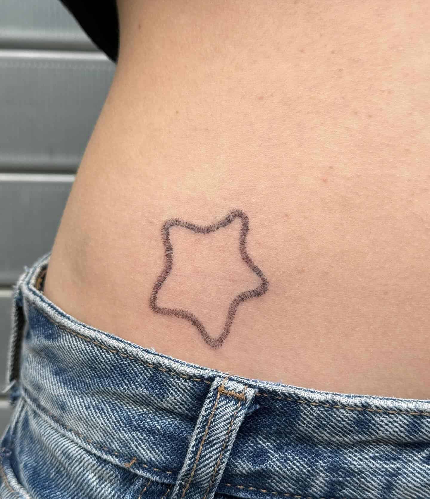 38] Outline Star Hip Tattoo: Celestial Beauty