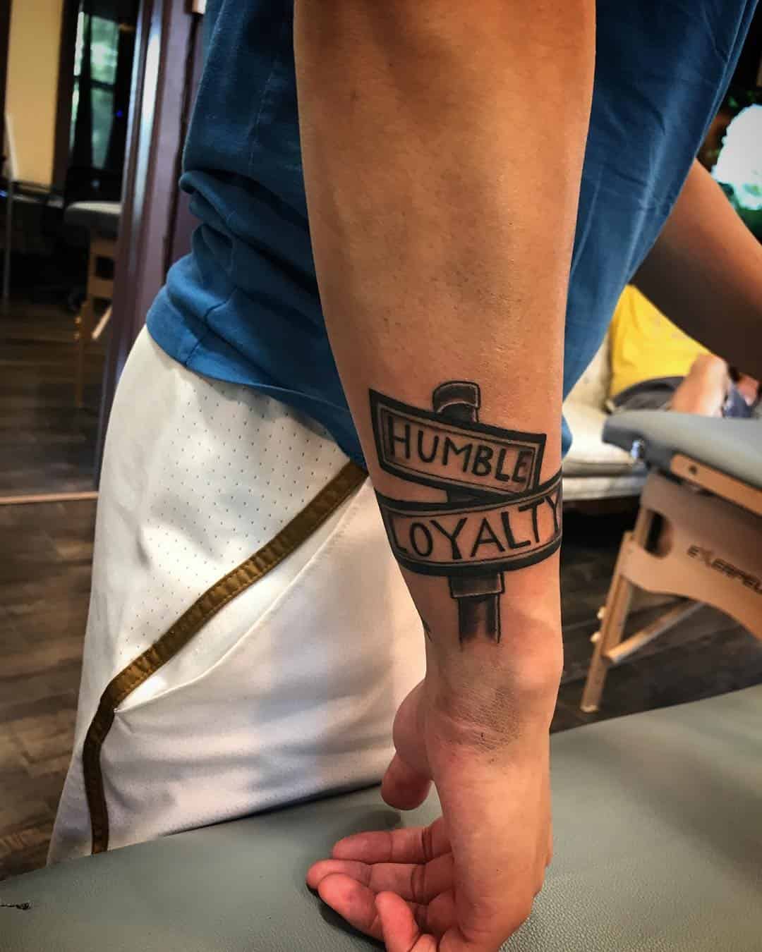 15] Humble Loyalty Street Sign Tattoo: Mark of Dedication