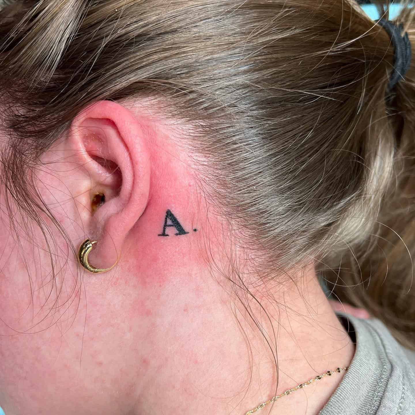 14] ‘A.’ Text Tattoo: Ear Statement