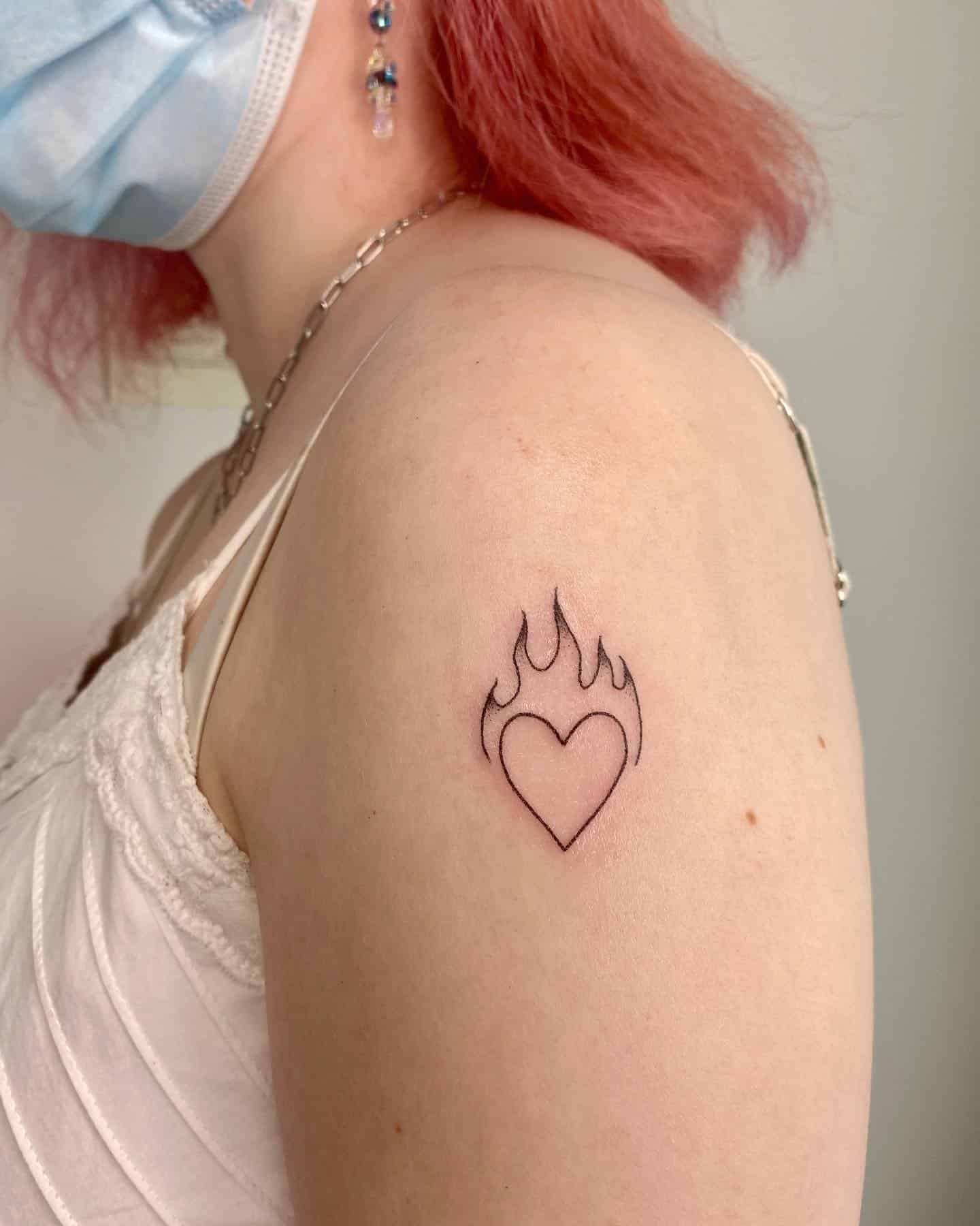 50] Upper Arm Heart Flame Tattoo: Passionate Design